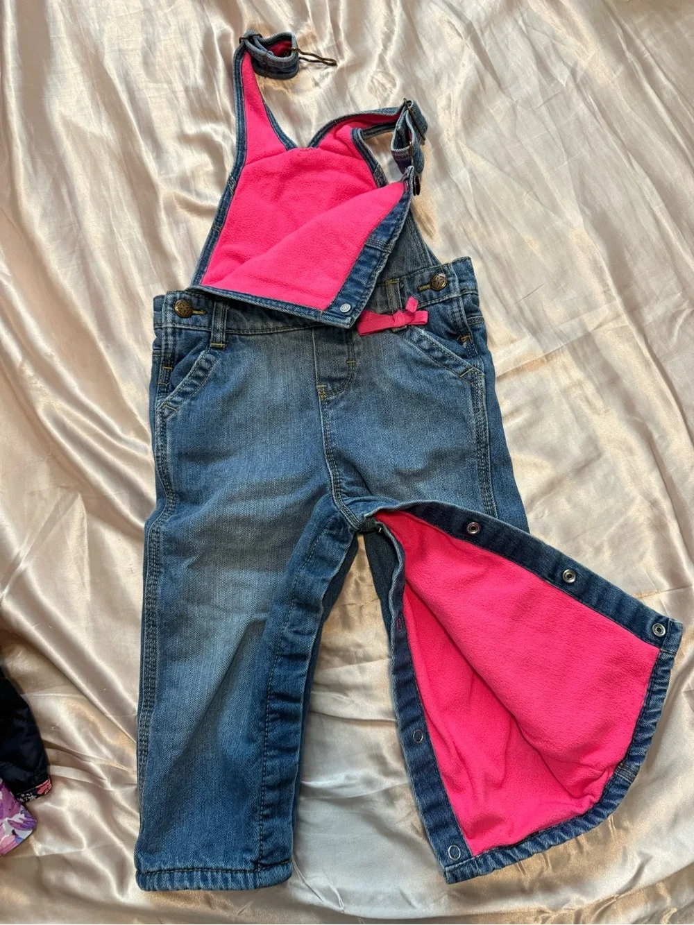 OshKosh B'gosh Fleece lined denim overalls.